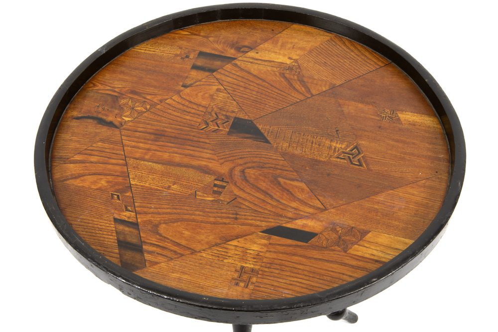 antique occasional table with a round parquetry top on a base with three crossed legs in ebonized - Image 2 of 2