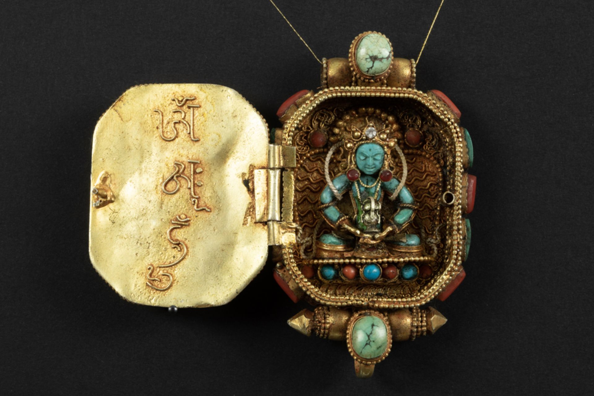 Tibeto Nepalese ghau in yellow gold on silver with turquoise, lapis lazuli and coral and with the - Image 2 of 3