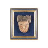 Ancient Egyptian Ptolemaic period death mask in wood with remains of the original polychromy ||