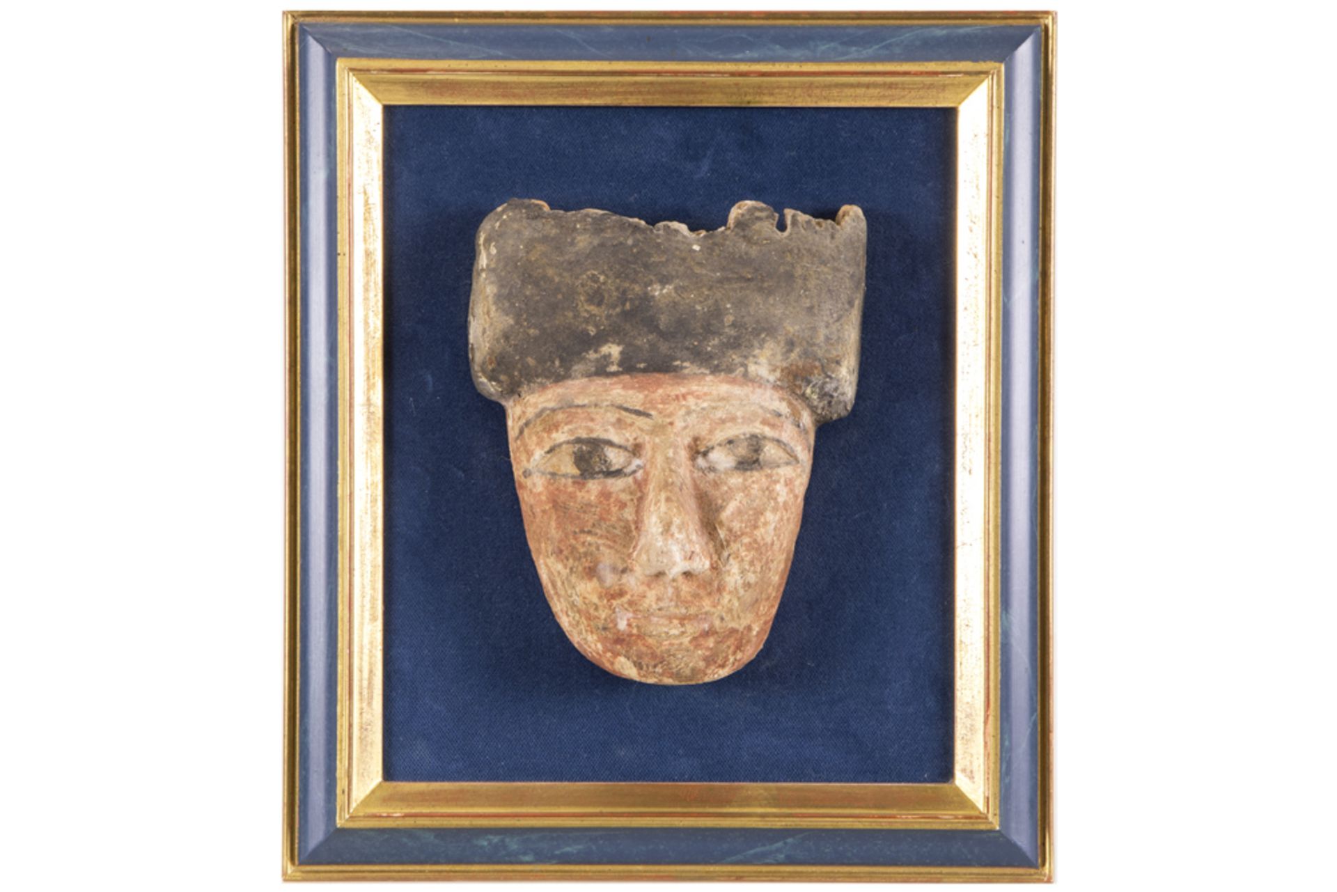 Ancient Egyptian Ptolemaic period death mask in wood with remains of the original polychromy ||
