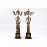 pair of 'antique' caryatid candelabra in gilded bronze and marble each with an Ancient Roman lady ||