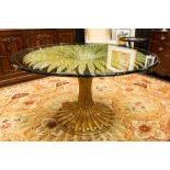 nineties' "Regency" design table with a base in partially gilded wood with typical leaves and with a