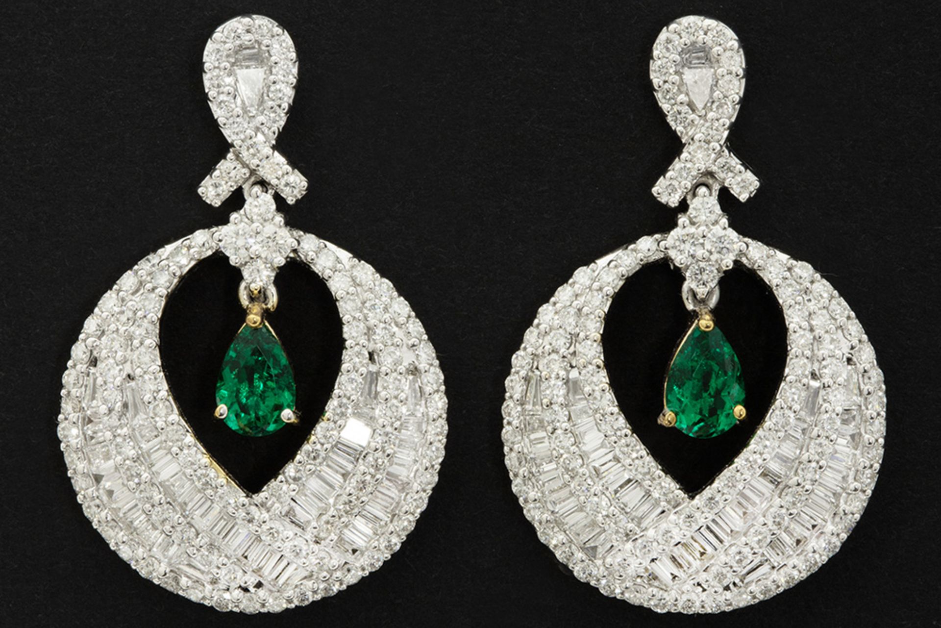 matching pair of earrings in white gold (18 carat) with ca 2,60 carat of very high quality brilliant