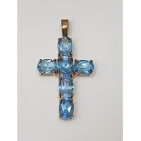 BLUE OVAL TOPAZ CROSS 9CT YELLOW GOLD IN GIFT BOX WITH VALUATION CERTIFICATE OF £895