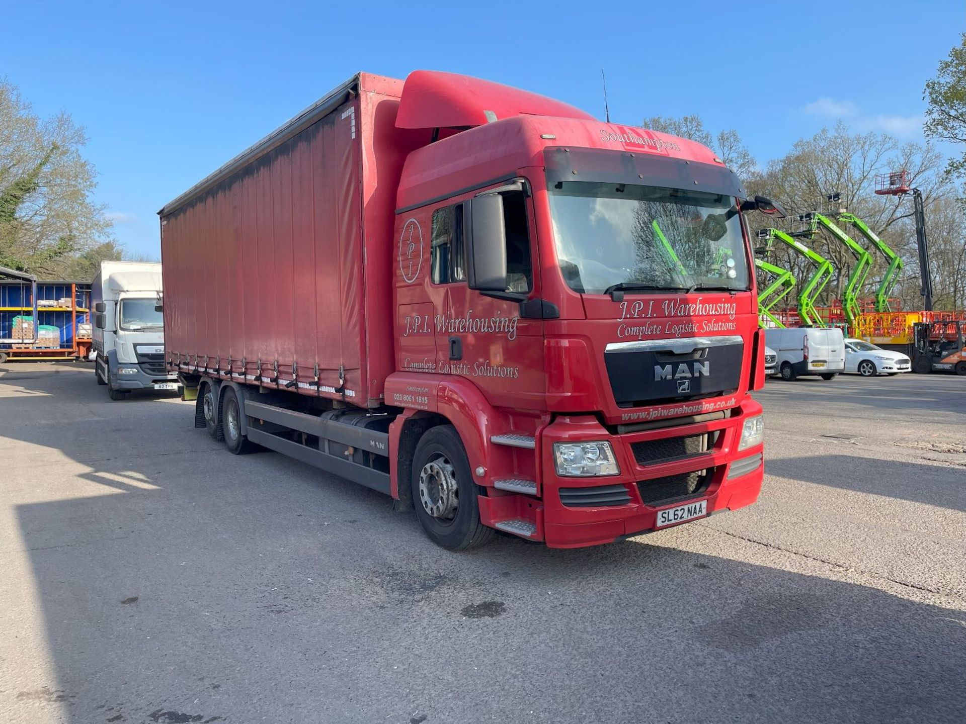 MAN TGS 26.320 26T CURTAINSIDE RIGID TRUCK WITH DHOLLANDIA TUCK UNDER TAIL LIFT