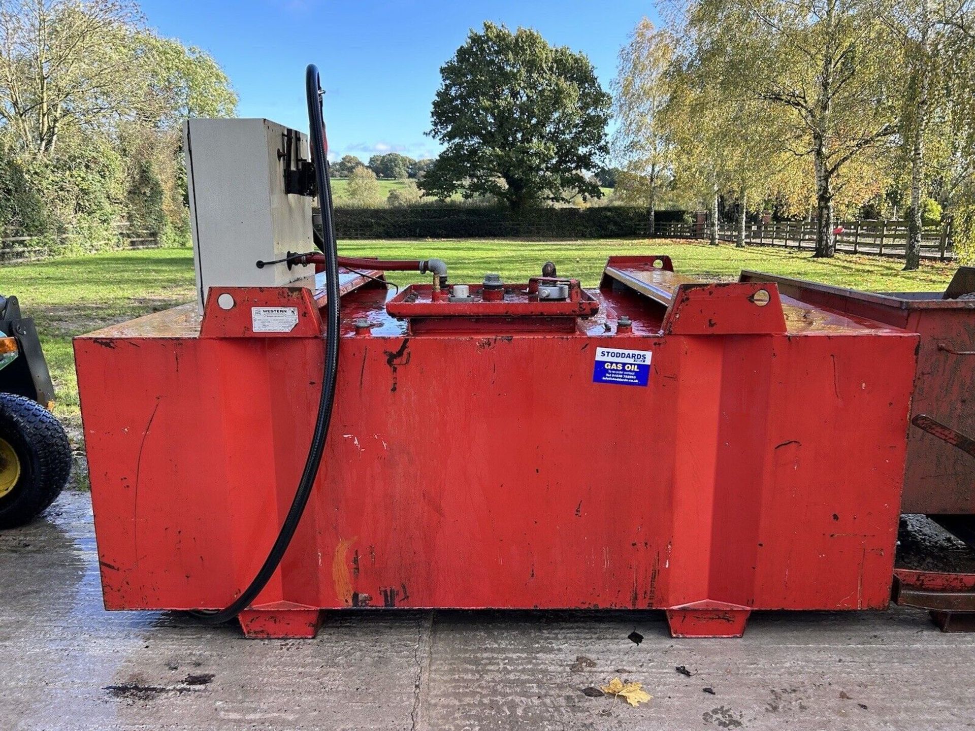 2000L BUNDED DIESEL TANK WITH 230V PUMP AND DELIVERY HOSE WITH LITRE COUNTER.