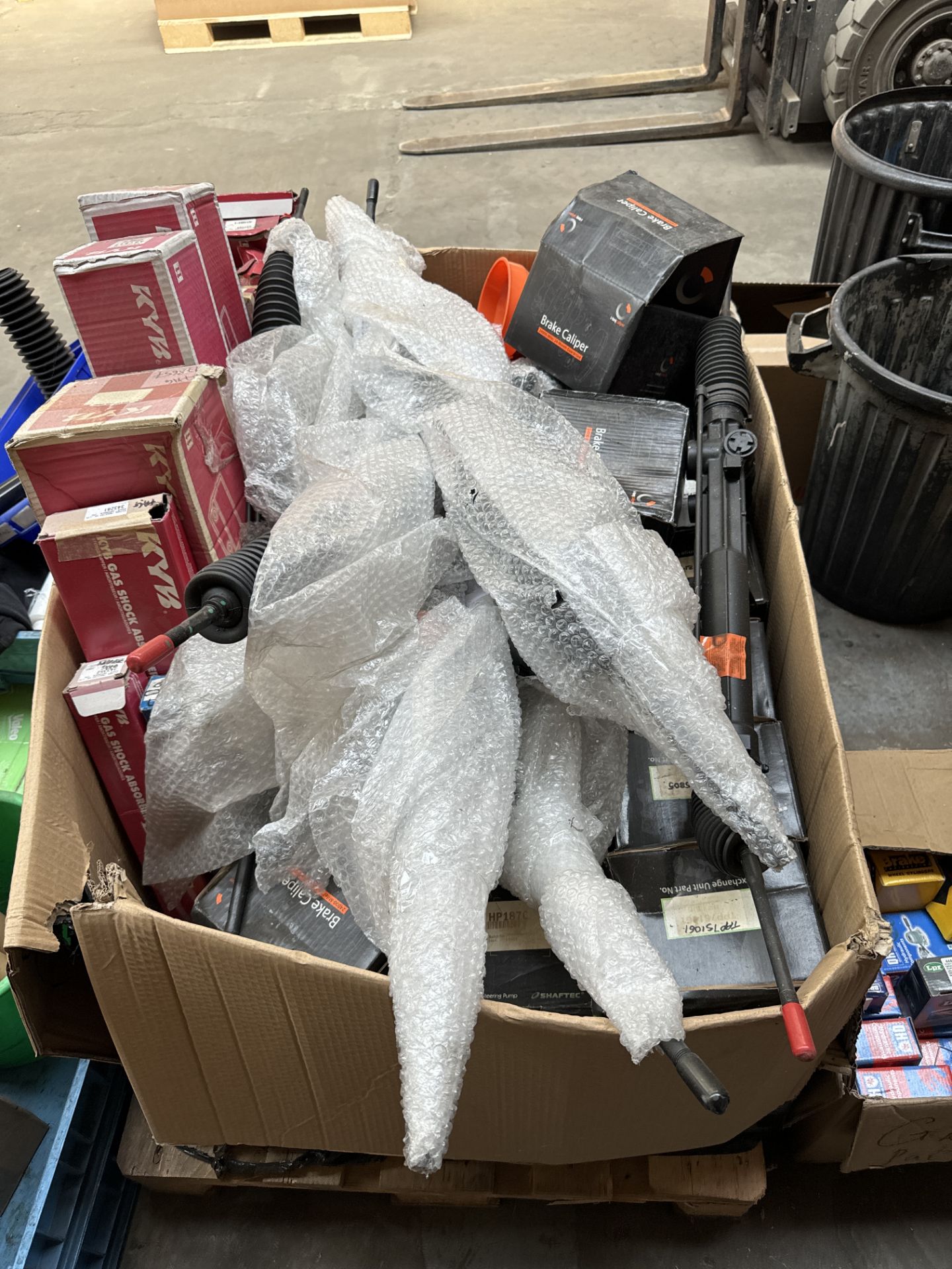 PALLET OF MIXED CAR PARTS - SHOCK ABSORBERS CALIPERS AND STEERING RACKS