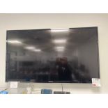 Finlux Smart television with remote (wall mounted, model unknown, approx 42”)