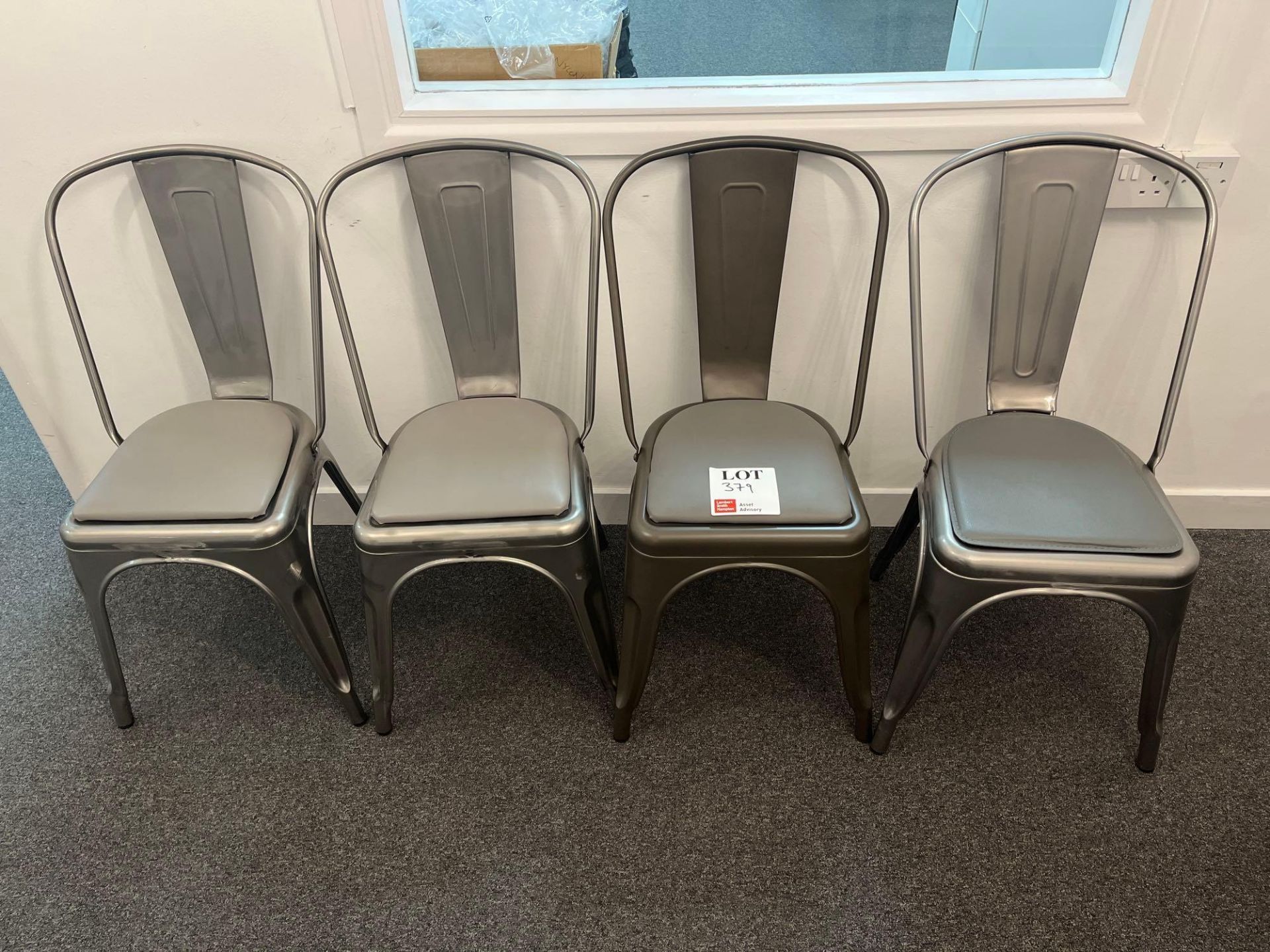 Four metal framed chairs with cushion upholstered seat