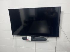 Wall mounted NEC 50” digital signage display with remote and Trust sound bar and camera