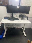 White adjustable height desk with two monitors (approximately 120cm L x 70cm W)