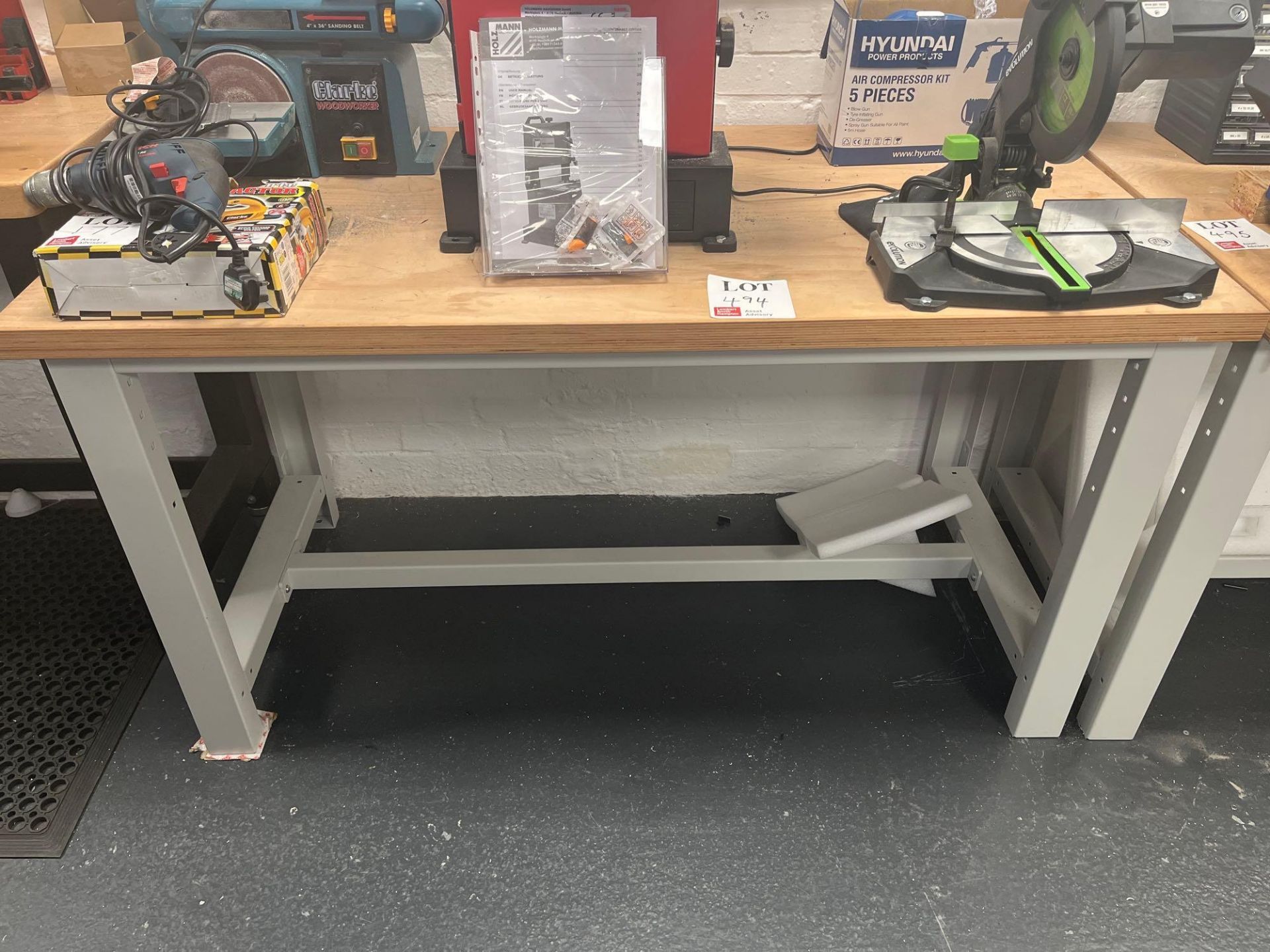 Wood top metal framed workbench (excludes contents) (approximately 151cm L x 75cm W x 85cm H)