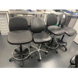 Four various black chairs