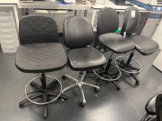 Four various black chairs