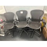 Herman Miller Aeron-style Three black mesh back operator chairs