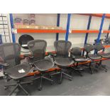 Three black mesh back operator chairs with three various black chairs