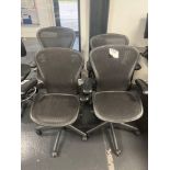 Herman Miller Aeron-style Four black mesh back operator chairs