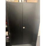 Manutan black metal two door cabinet and contents comprising a quantity of various screws, fixings,