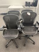 Herman Miller Aeron-style Four black mesh back operator chairs