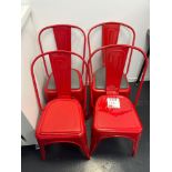Four industrial style red metal chairs