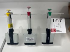 Three various multi-application automatic pipette dispensers with stand