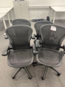 Herman Miller Aeron-style Four black mesh back operator chairs