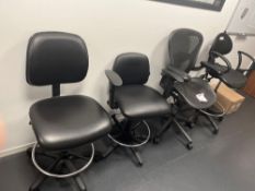 Four various black chairs