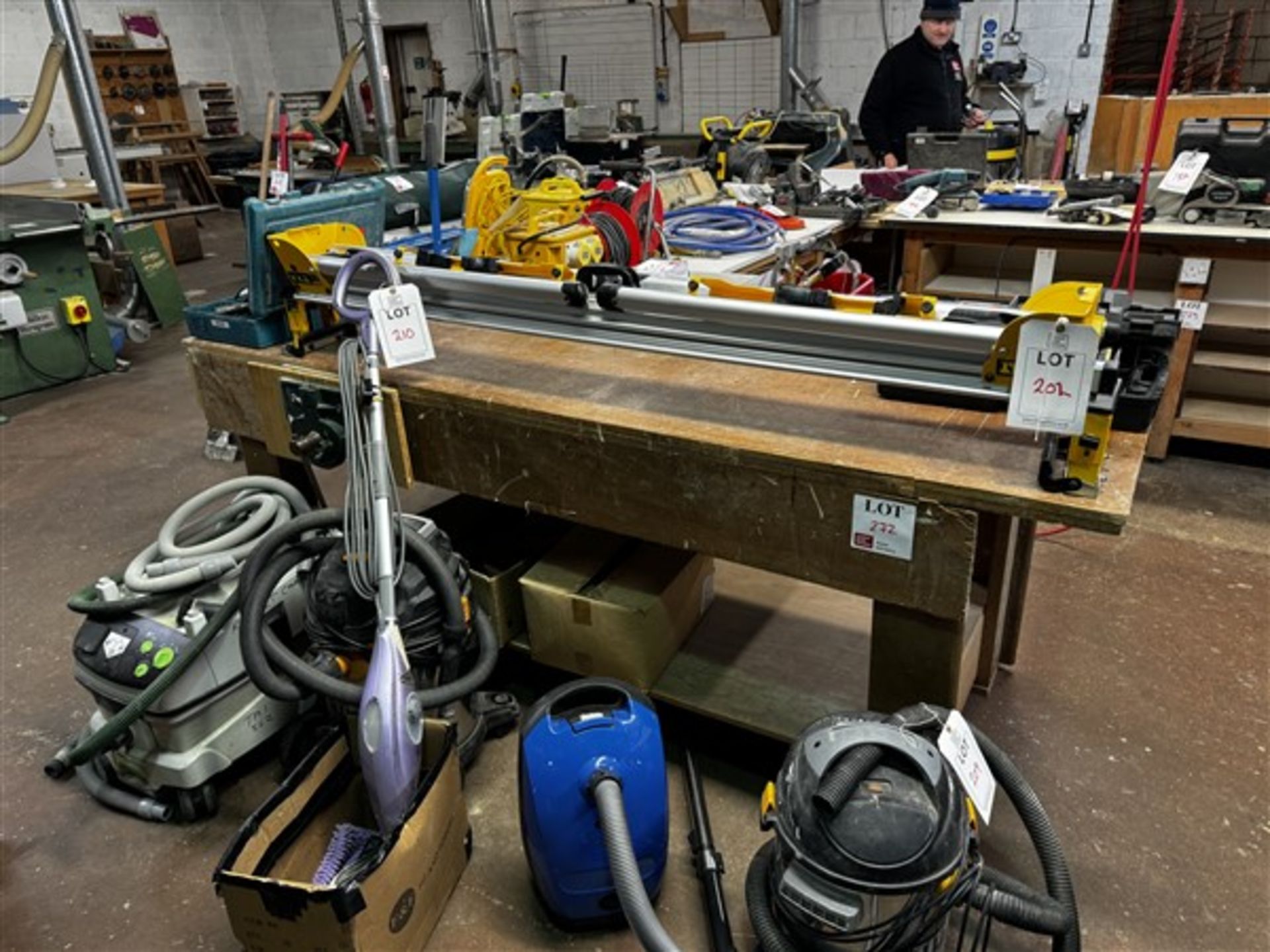 Wooden work benches, 2.4m x 1m, with two carpentry vices