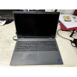 Dell Latitude 3540 laptop with charger