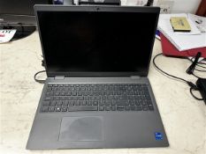 Dell Latitude 3540 laptop with charger