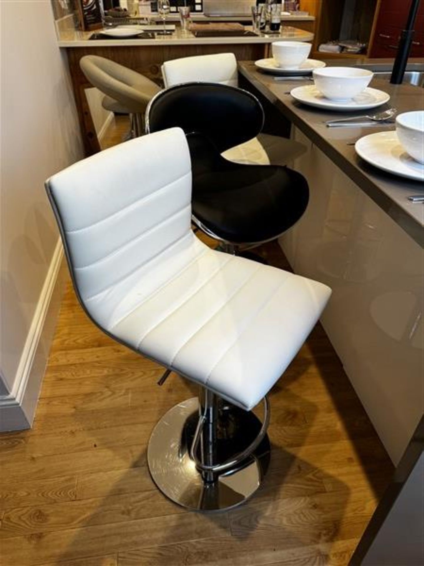 Five various leather effect bar stools