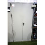 Metal double-door storage cabinet with contents