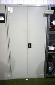 Metal double-door storage cabinet with contents