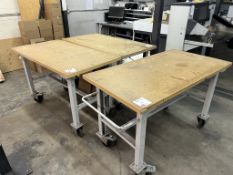 Three timber top metal mobile work benches