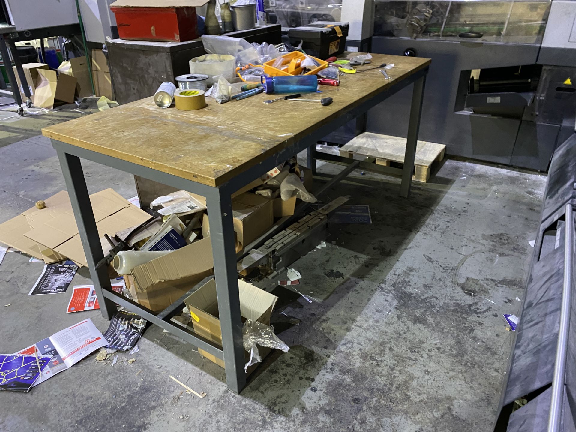 Four metal framed timber topped work benches