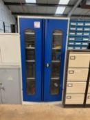 Metal 2 door storage cupboard with contents including tools boxes, 110v tool spares, extension