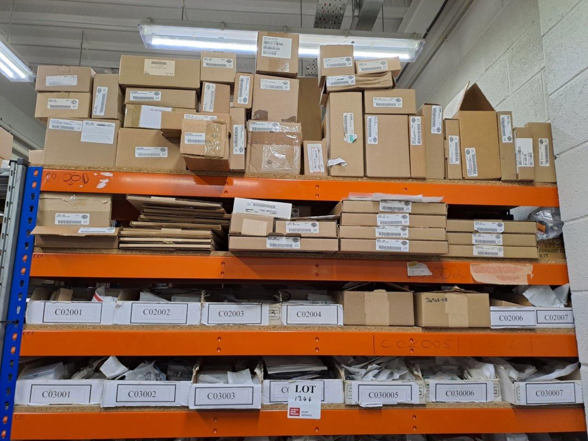Quantity of Harley Davidson parts, to 4 shelves as pictured
