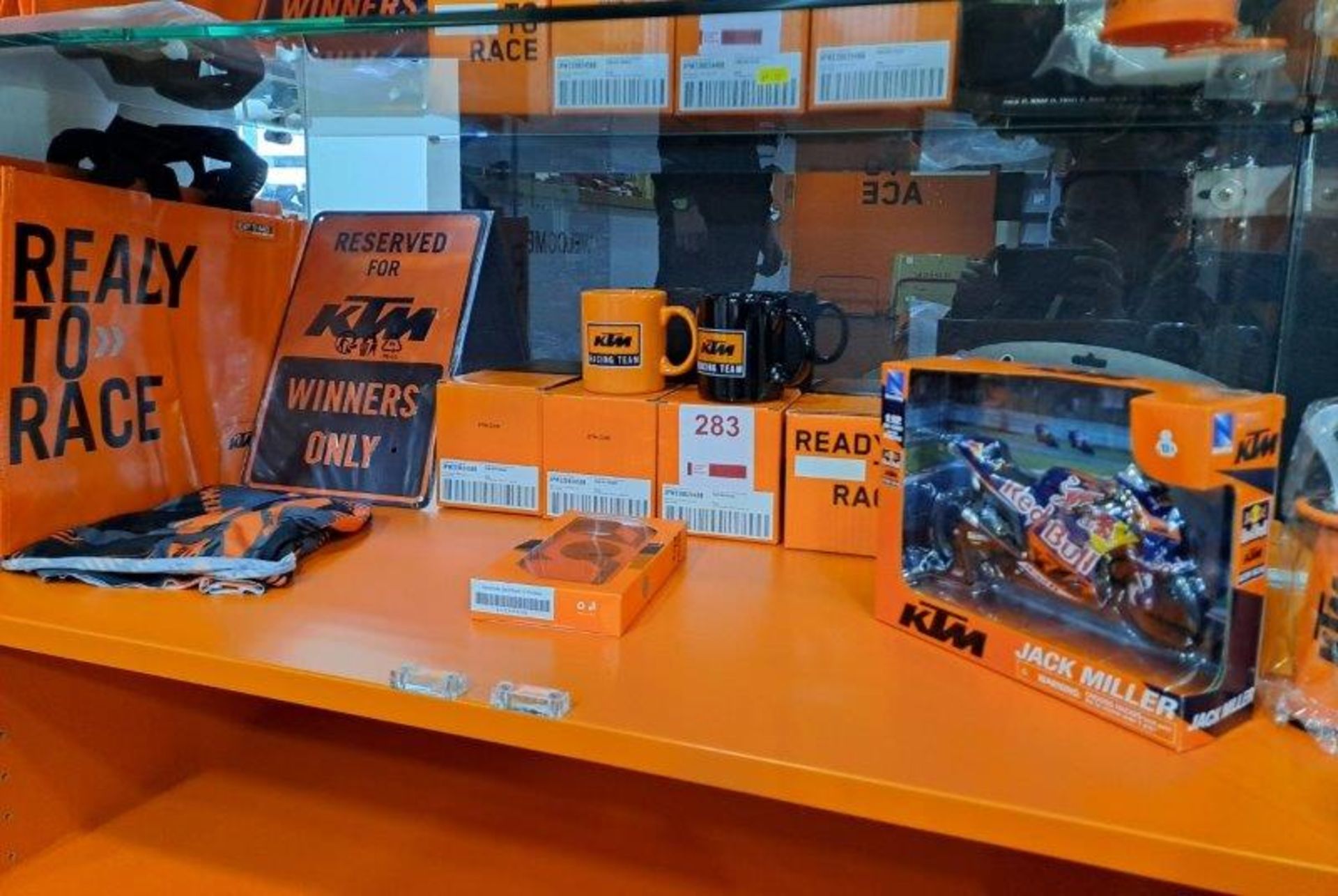 Contents of shelf of KTM Merchandise as pictured