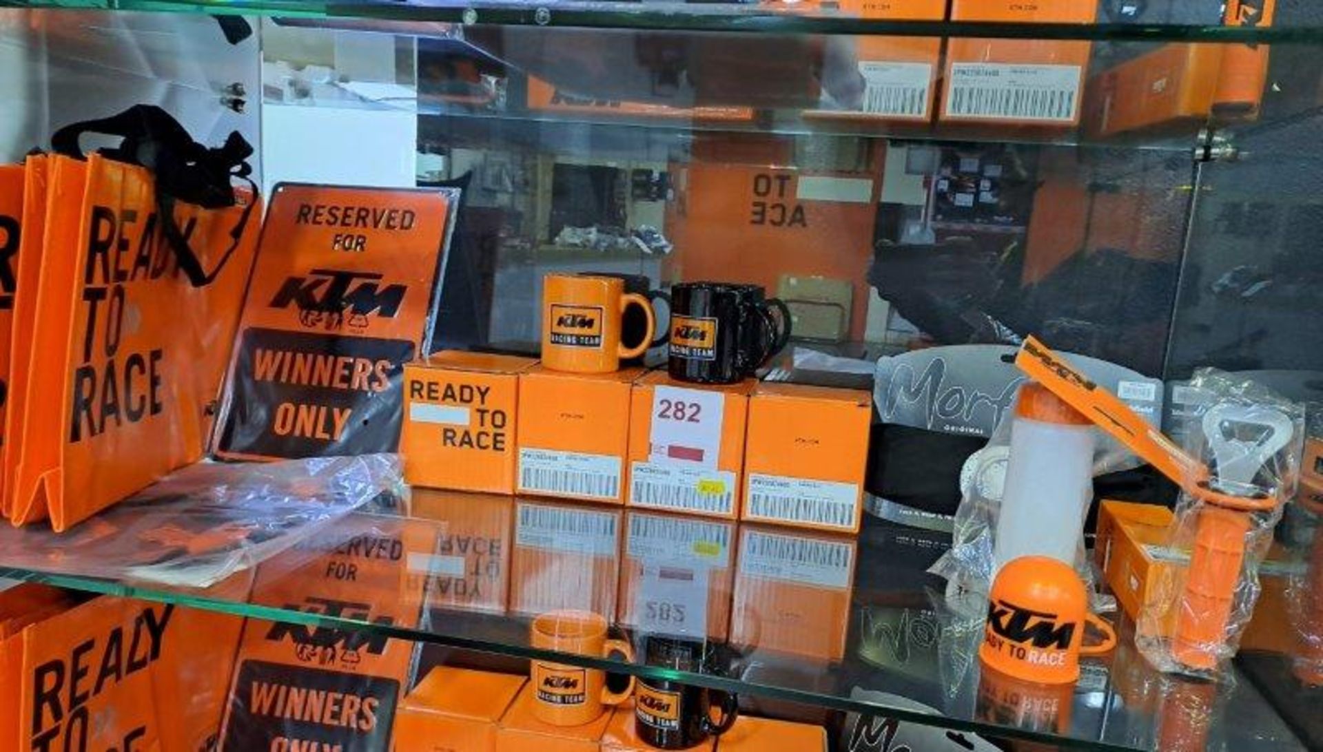 Contents of shelf of KTM Merchandise as pictured