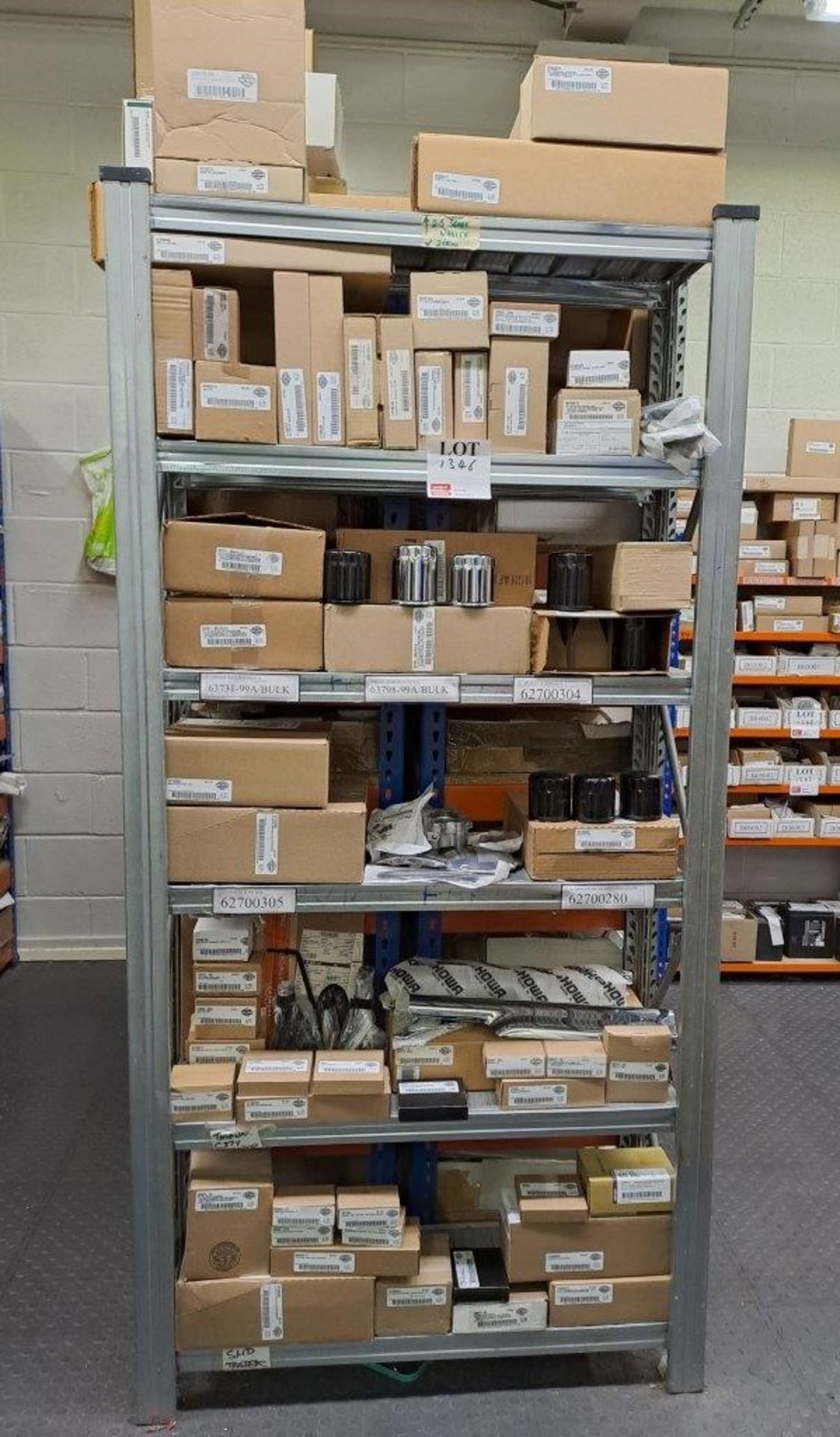 Quantity of Harley Davidson parts, to 6 shelves as pictured