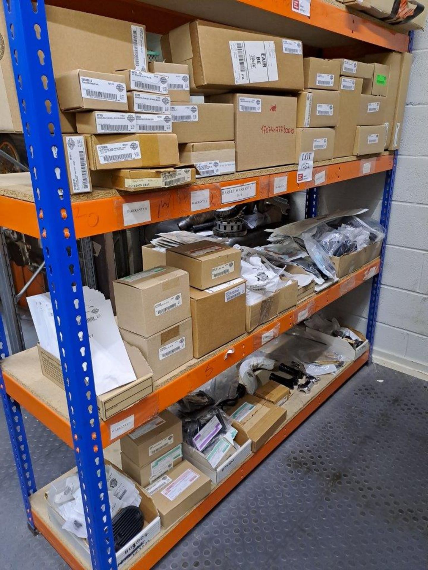 Quantity of Harley Davidson parts, to 3 shelves as pictured