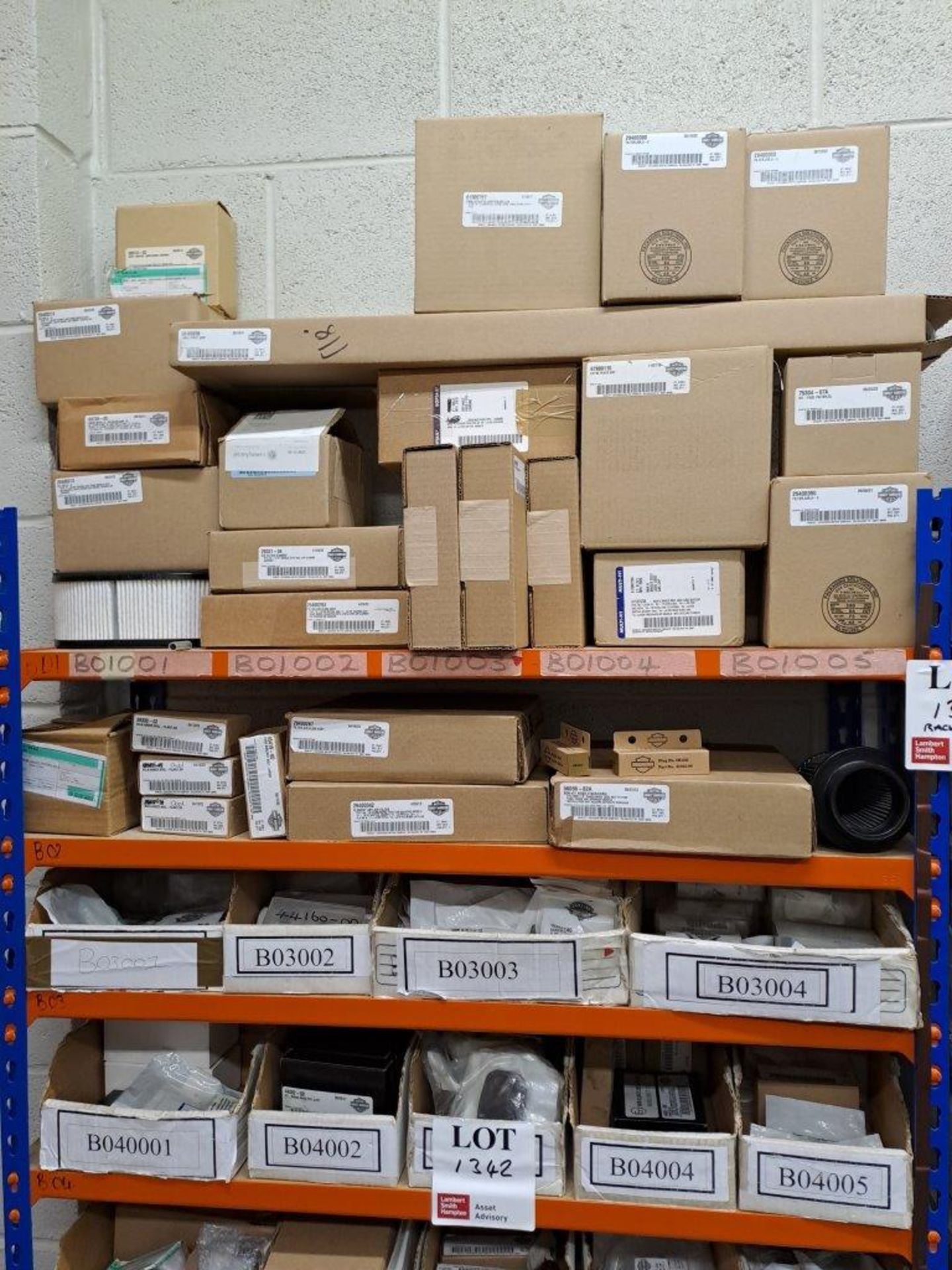 Quantity of Harley Davidson parts, to 4 shelves as pictured