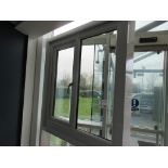 Aluminium framed single door showroom window