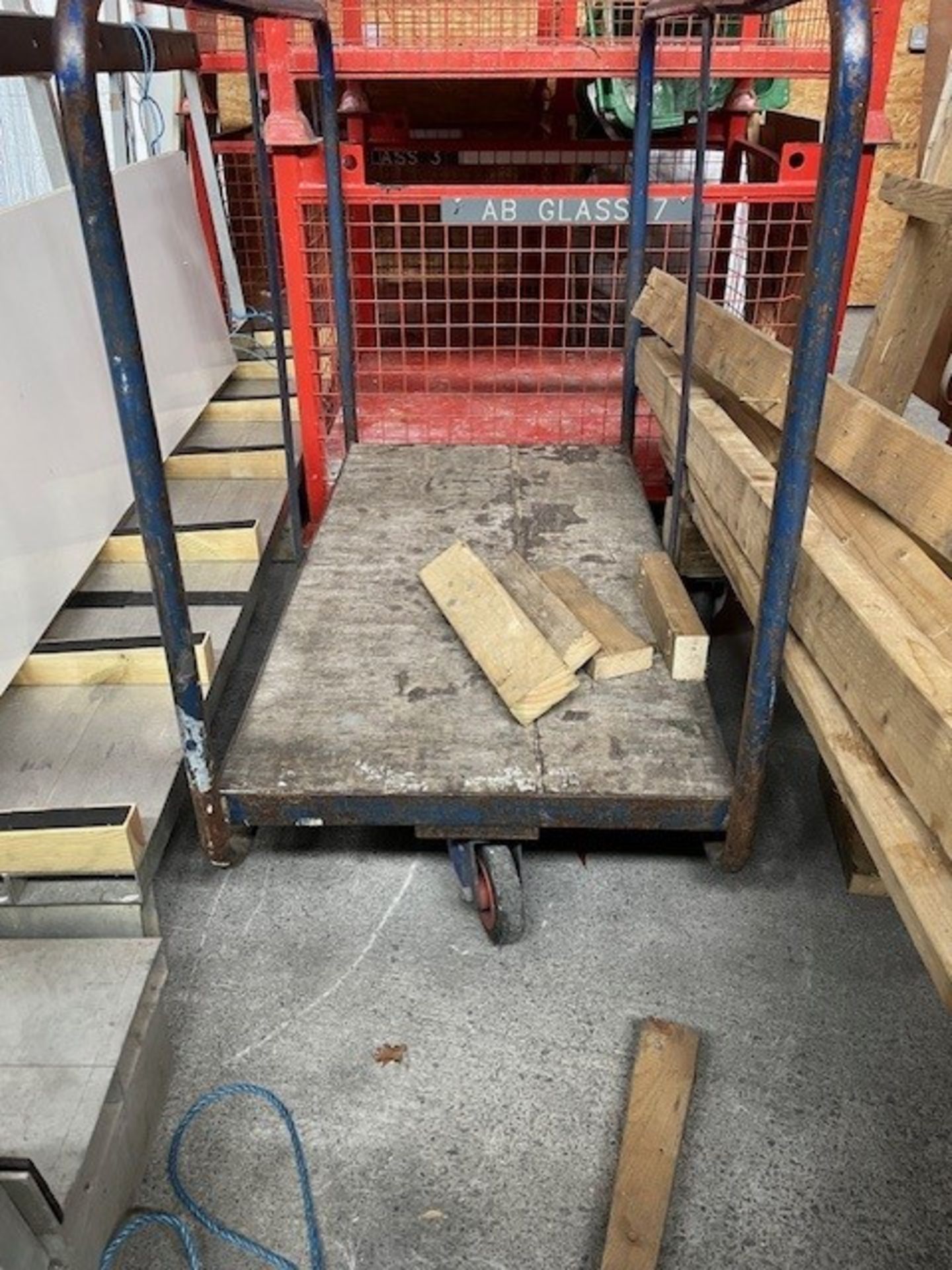 Wooden mobile stillage and a metal trolley