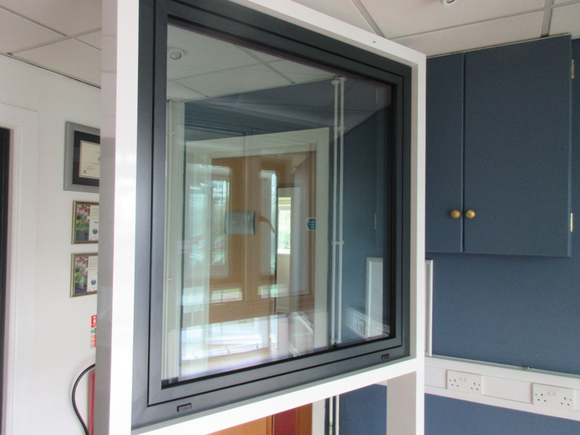 Aluminium framed single door showroom window