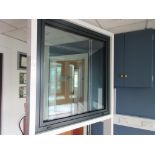 Aluminium framed single door showroom window