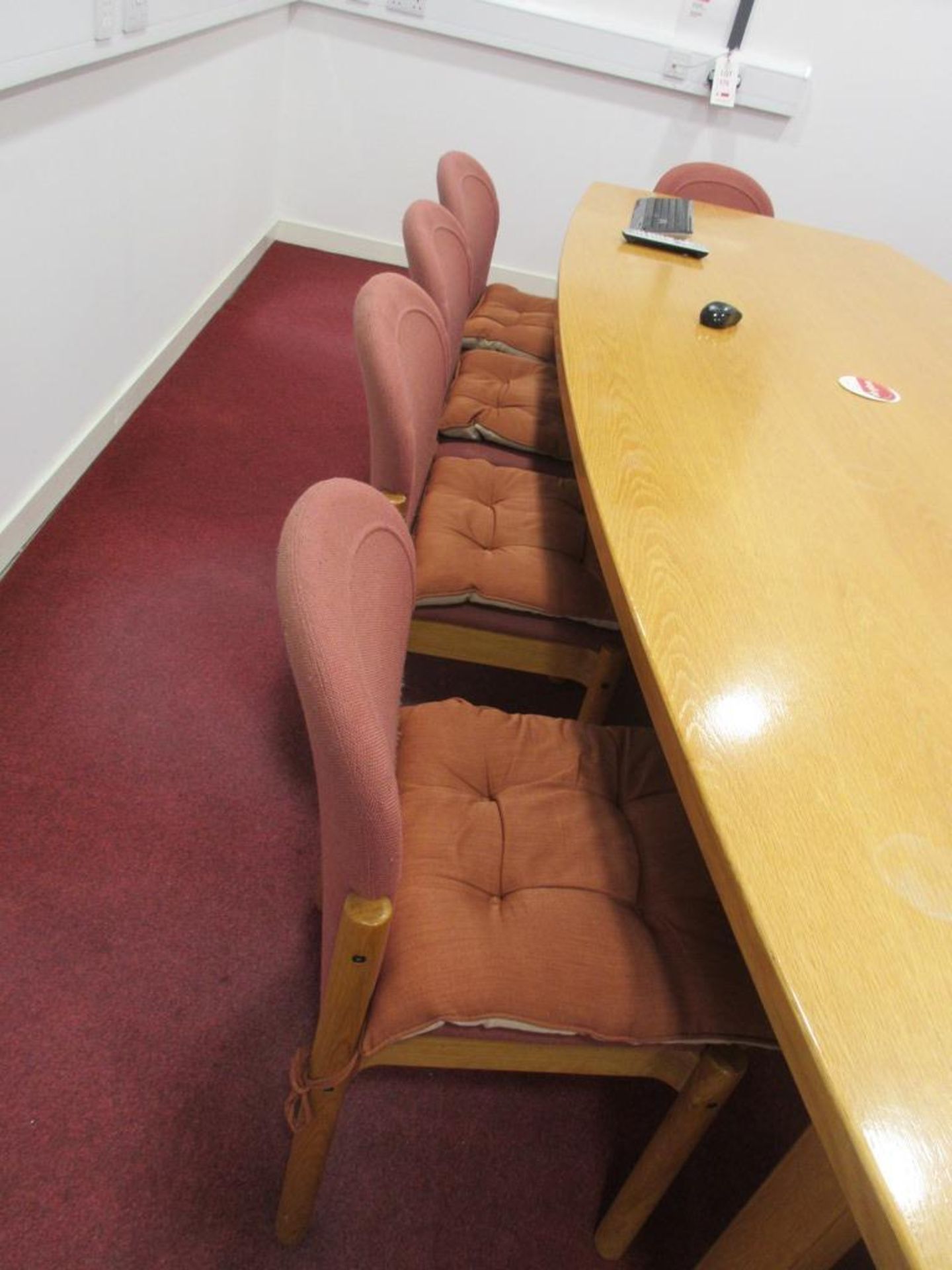 Ten light wood framed pink cloth upholstered boardroom chairs