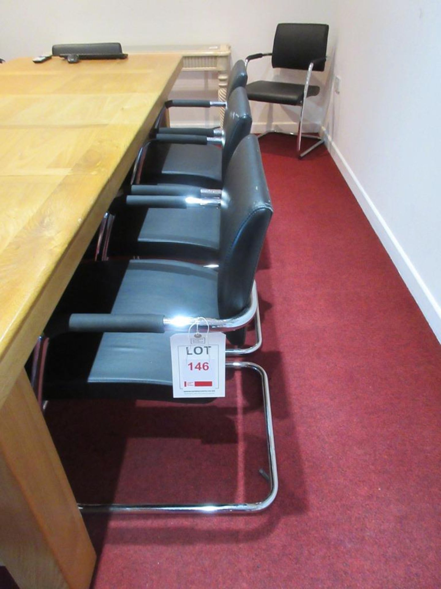 Ten chrome framed leatherette static boardroom armchairs