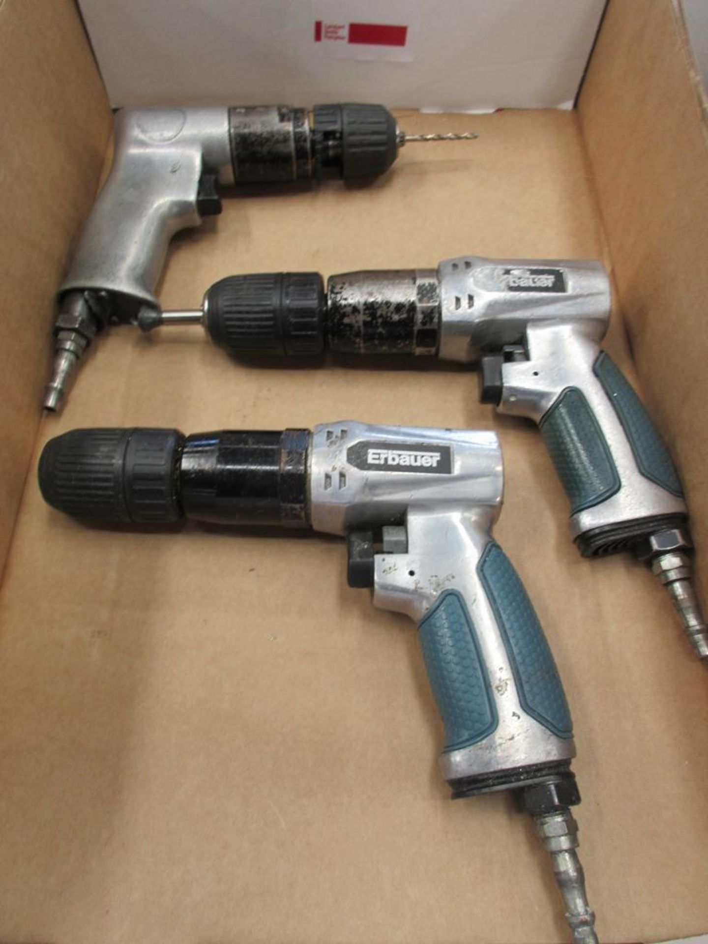 Three assorted pneumatic pistol grip drills