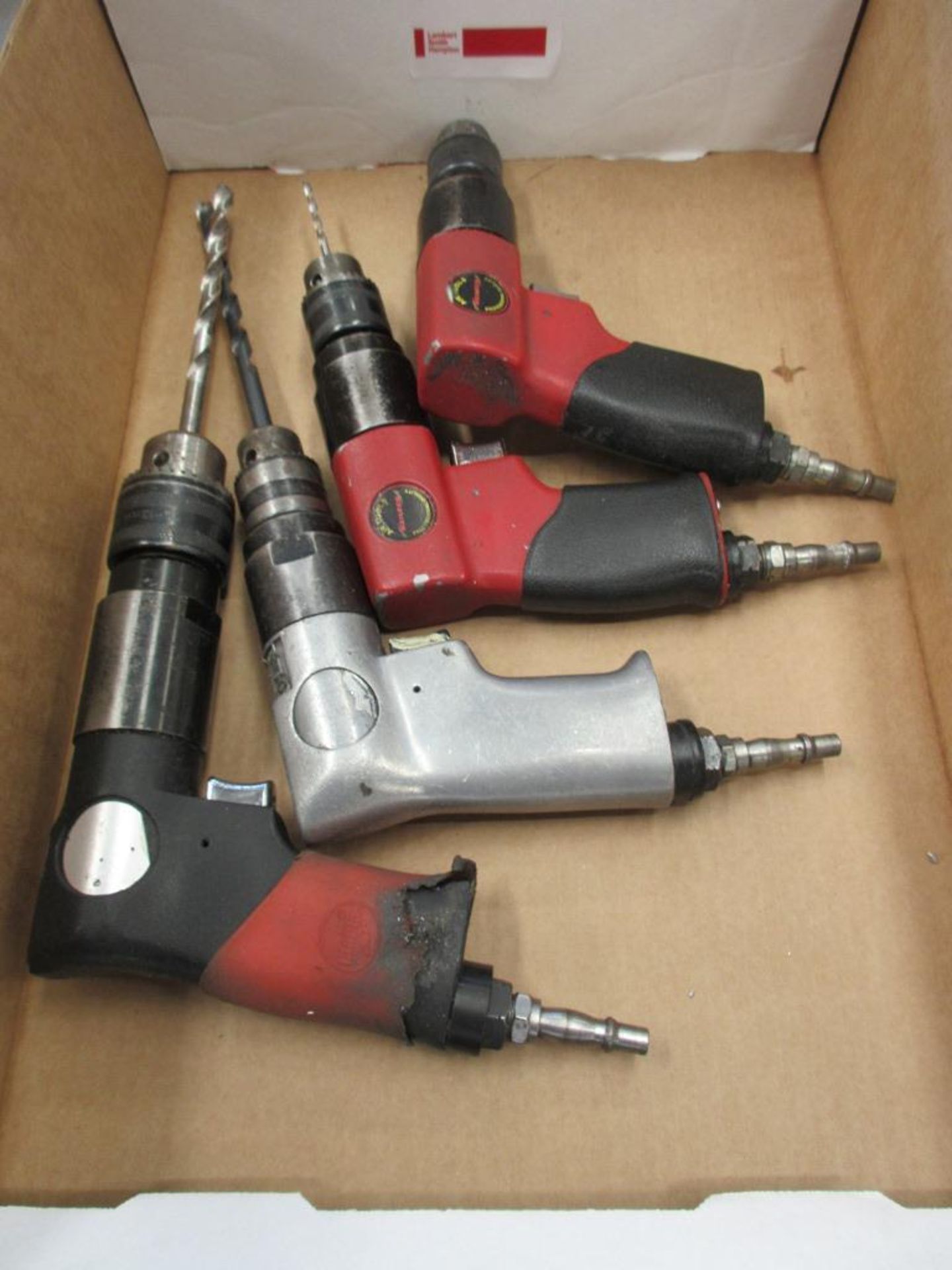 Four assorted pneumatic pistol grip drills